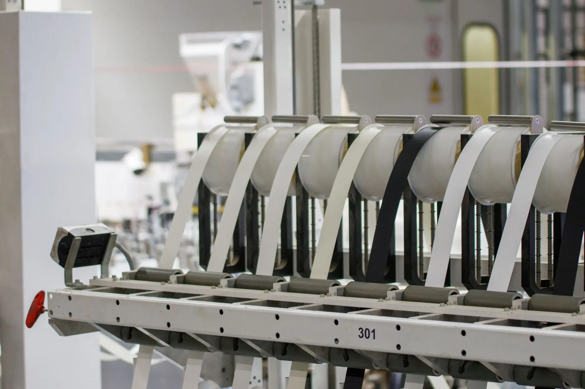 Modern automated manufacturing facility floor showing machinery and assembly lines in an industrial plant.