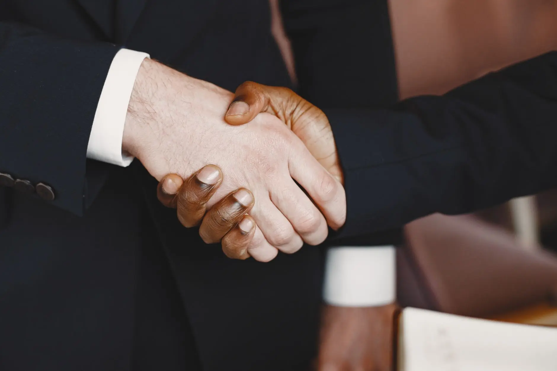 Business executives gathered at an international trade exhibition discussing regional investment opportunities.