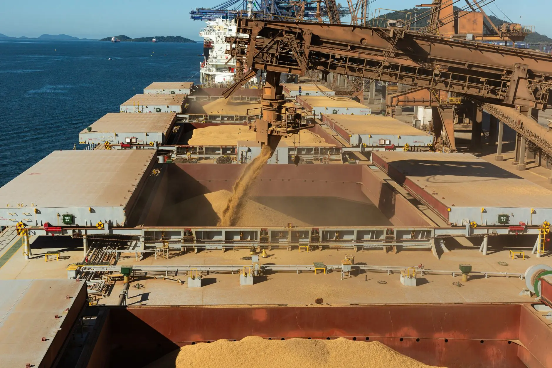 Cargo ship loading grain at a Turkish port facility for international trade